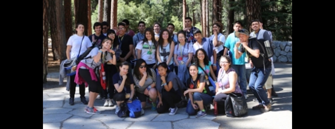 group of students in front of forest